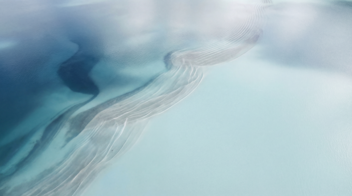 Crystal clear glacial water with gentle ripples